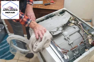 repairman repairing a broken washing machine