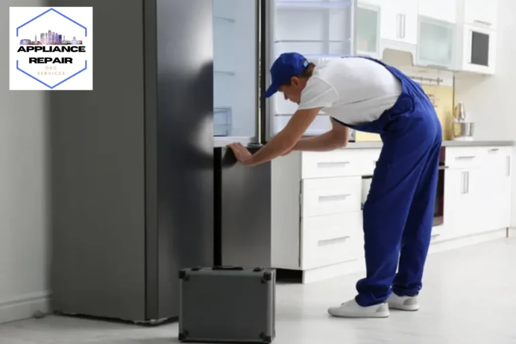 repairing refrigerator in kitchen