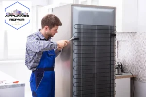 serviceman working on refrigerator