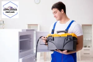 Repairman contractor repairing fridge