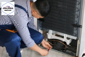 Worker repairing fridge