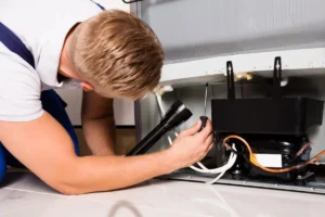 technician checking refrigerator