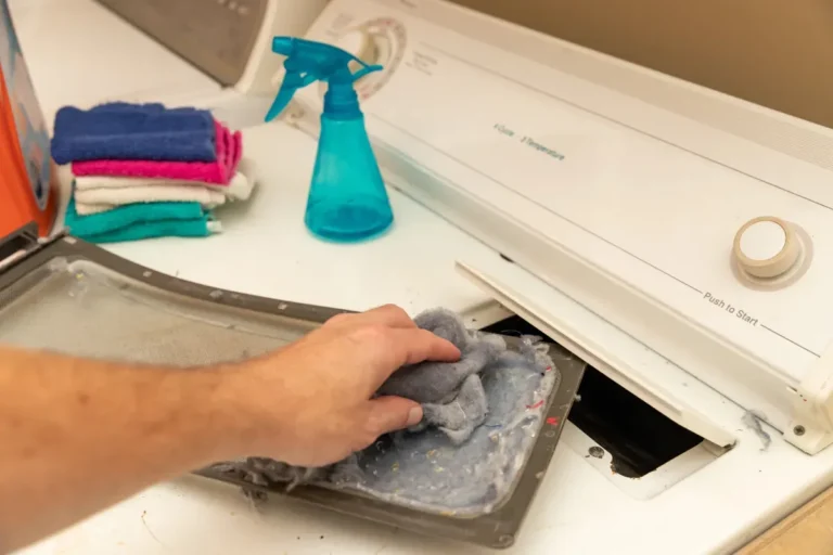 repairman fixing dishwasher