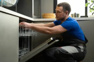 Repairman checking dishwasher