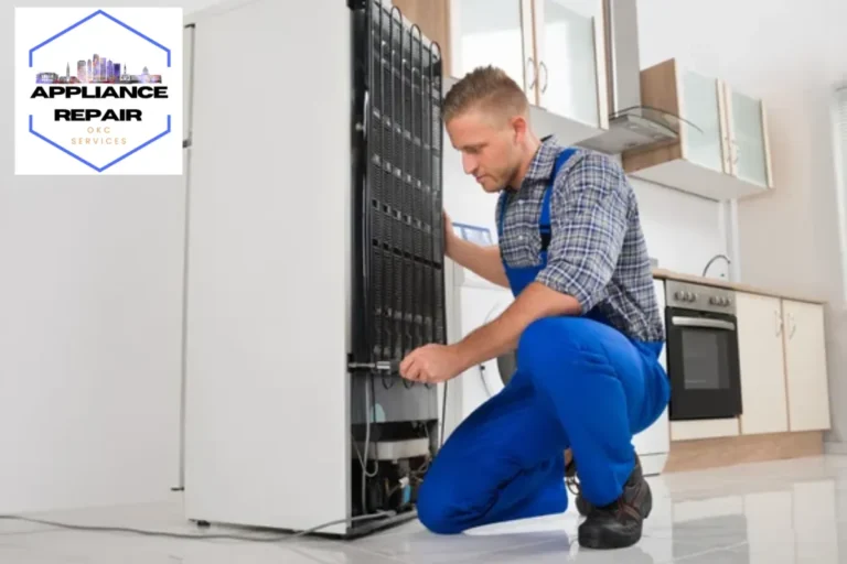 repairman repairing appliance in the kitchen
